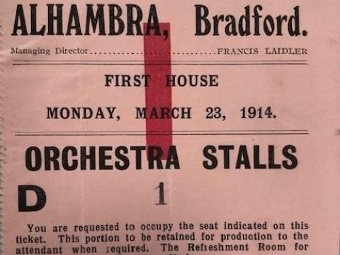 A theatre ticket from the Alhambra Theatre opening night on March 23 1914 with text that specifies Orchestra Stalls.